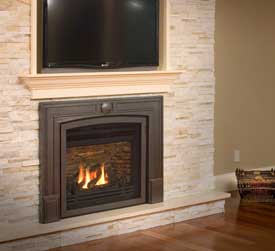 Horizon With Single Door Front by Valor with white surround made of stone with TV on the mantel