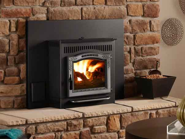 Pellet stove with beautiful front door hearth and surround are lots of odd shaped rocks