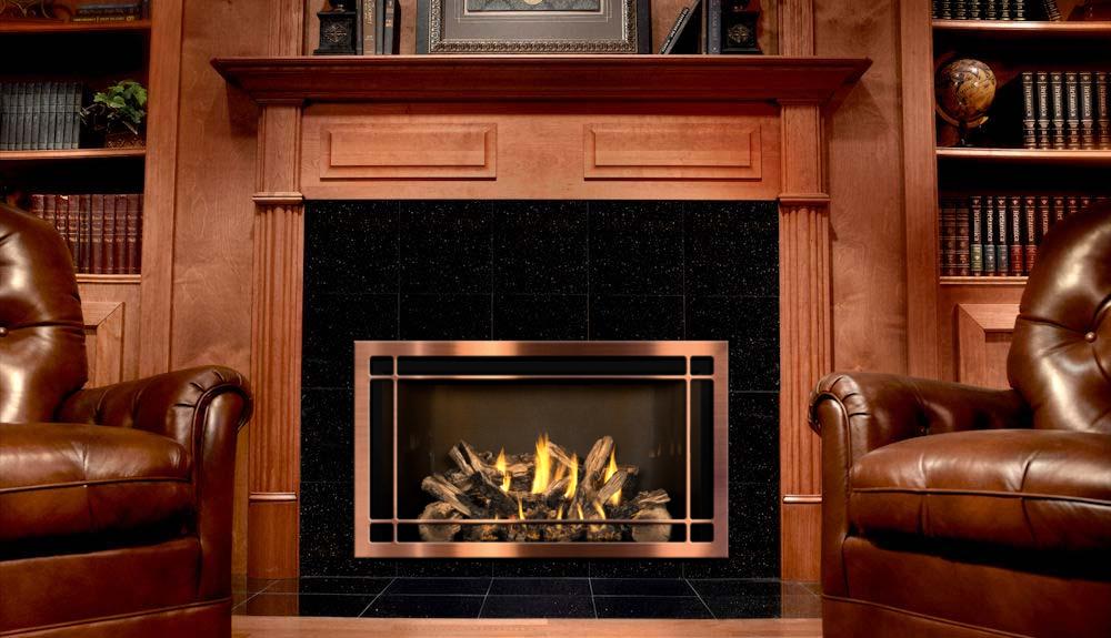 Beautiful gas fireplace with nice wooden surround - books shelves on each side and two leather chairs on the side