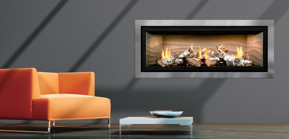Modern rectangular as Mendota fireplace with orange chair to the left and side table 